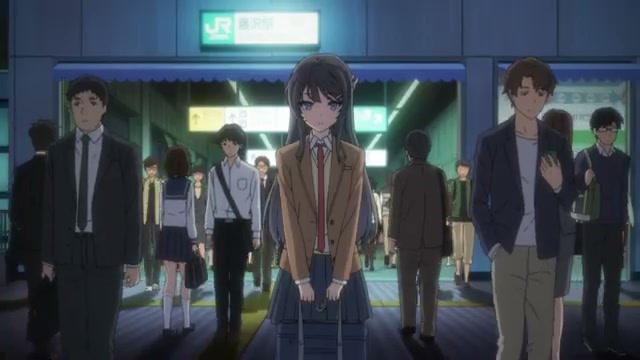 Mai Sakurajima standing alone in a crowd at the train station from Bunny Girl Senpai anime
